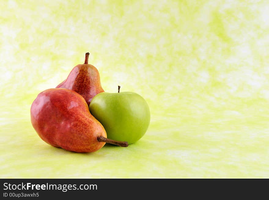 Pears and green apple isolated