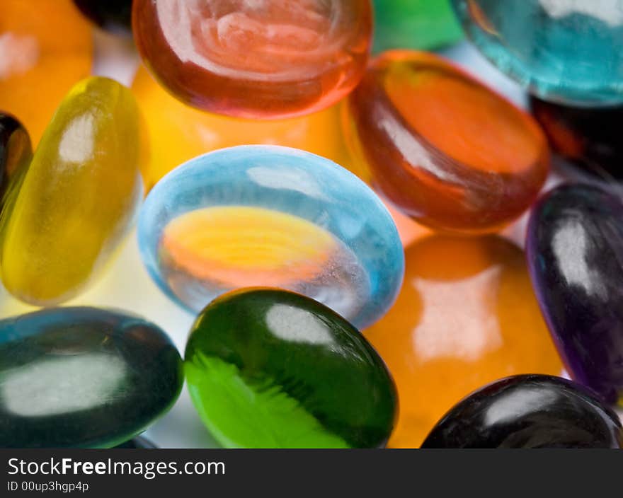 Macro of colorful glass drop beads for background or design element. Macro of colorful glass drop beads for background or design element.