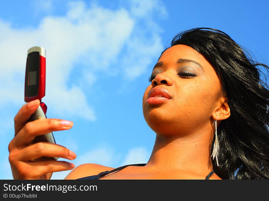 Attractive woman reading a text message