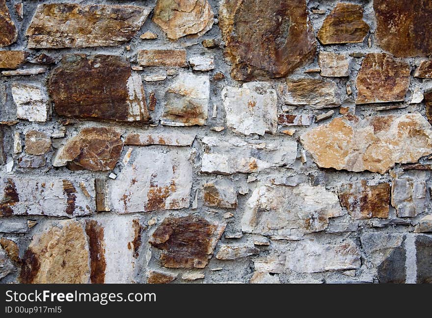 Crude stone wall and cement. Crude stone wall and cement