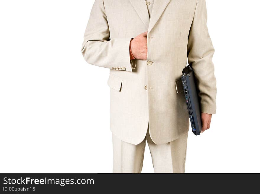 A business man in a white suit holding a laptop