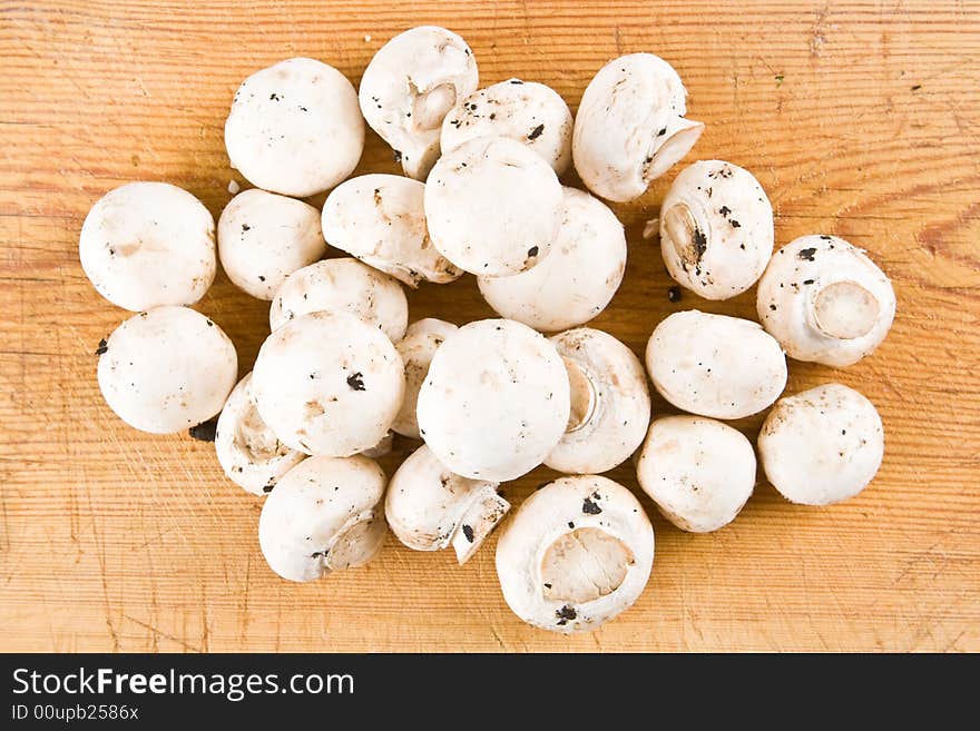 Mushrooms On A Wooden Board