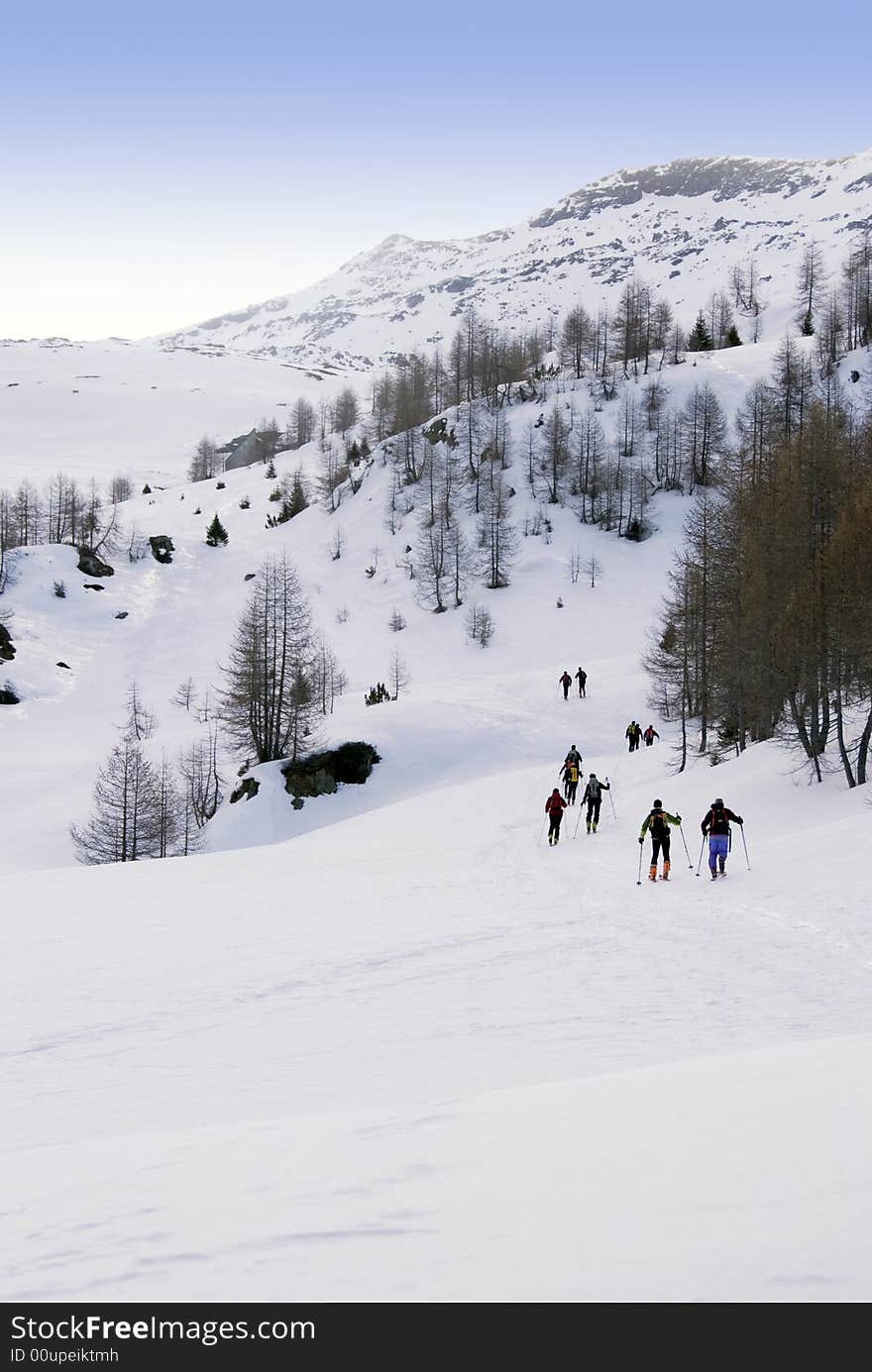 Ski mountaineering or cross country skiing in Italian Alps. Ski mountaineering or cross country skiing in Italian Alps