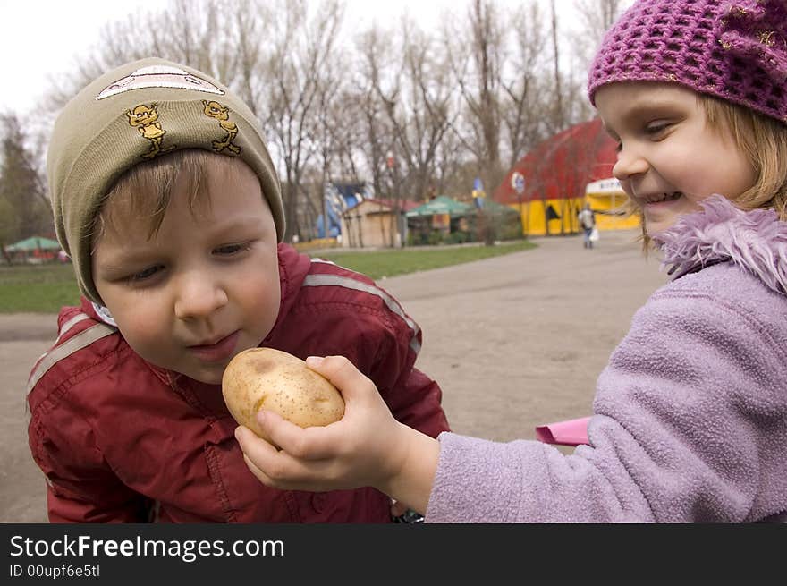 Children Playing With Potato