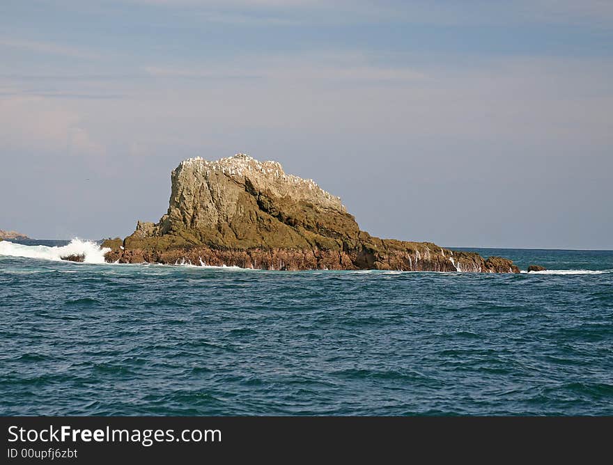 View of the Pacific ocean and rocks on the coast of Costa Rica