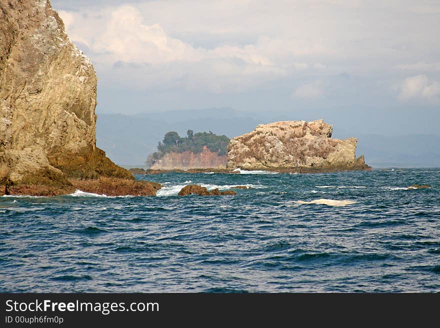 View of the Pacific ocean and rocks on the coast of Costa Rica. View of the Pacific ocean and rocks on the coast of Costa Rica