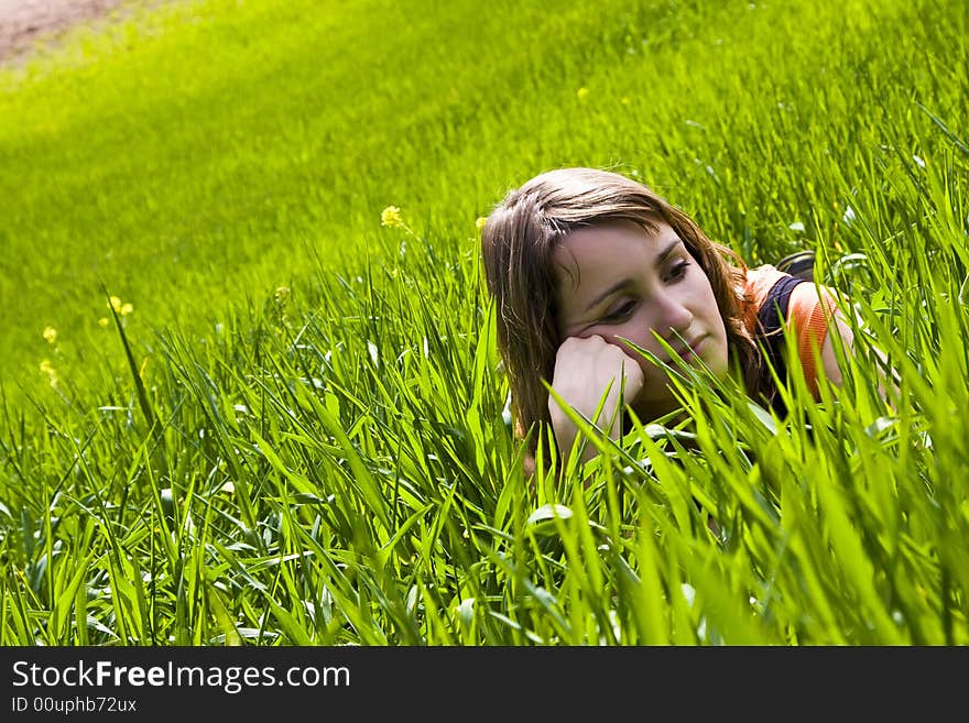 Young slept woman trough the grass. Young slept woman trough the grass