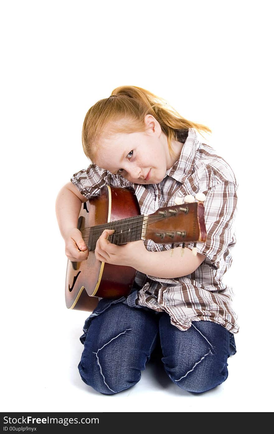 Girl playing on a guitar