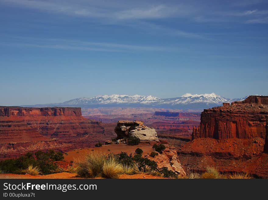 View of the red rock formations in Canyonlands National Park with blue sky�s and clouds. View of the red rock formations in Canyonlands National Park with blue sky�s and clouds