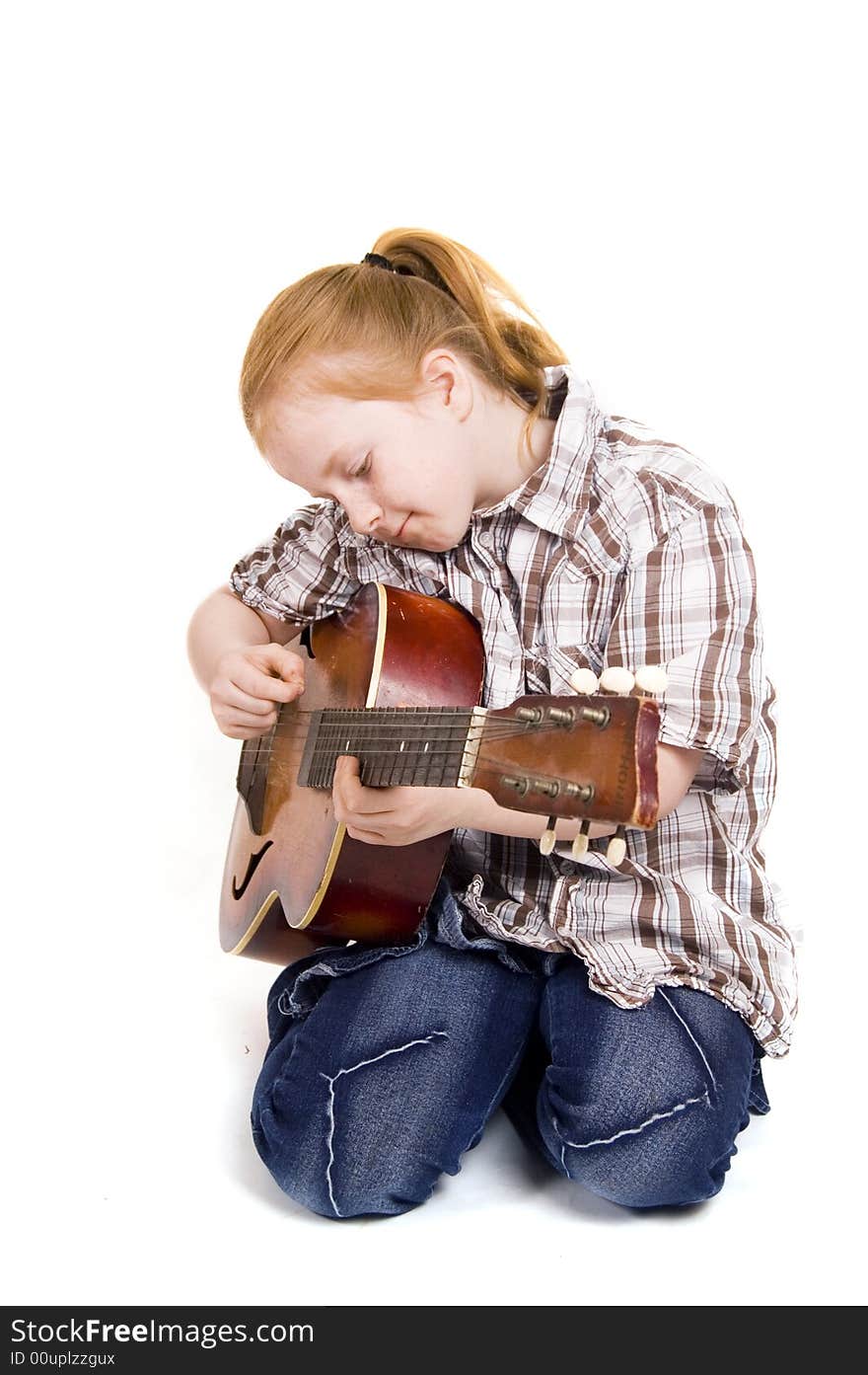 Girl playing on a guitar