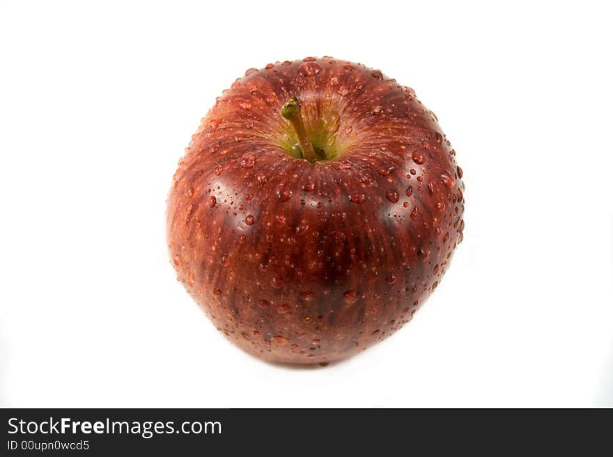 Red apple with waterdrops isolated on white. Red apple with waterdrops isolated on white