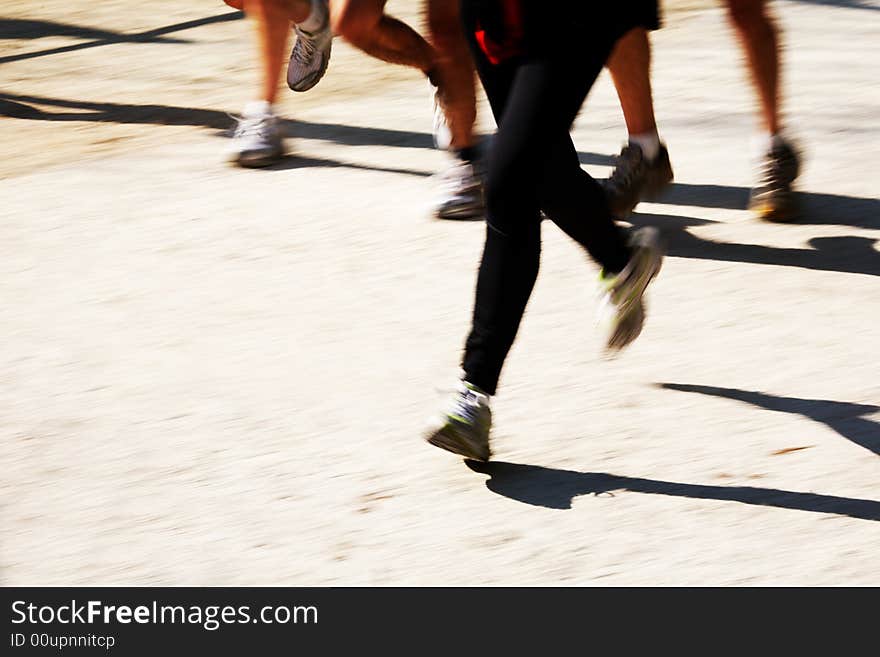 Runners legs with panning blur. horizontal frame.