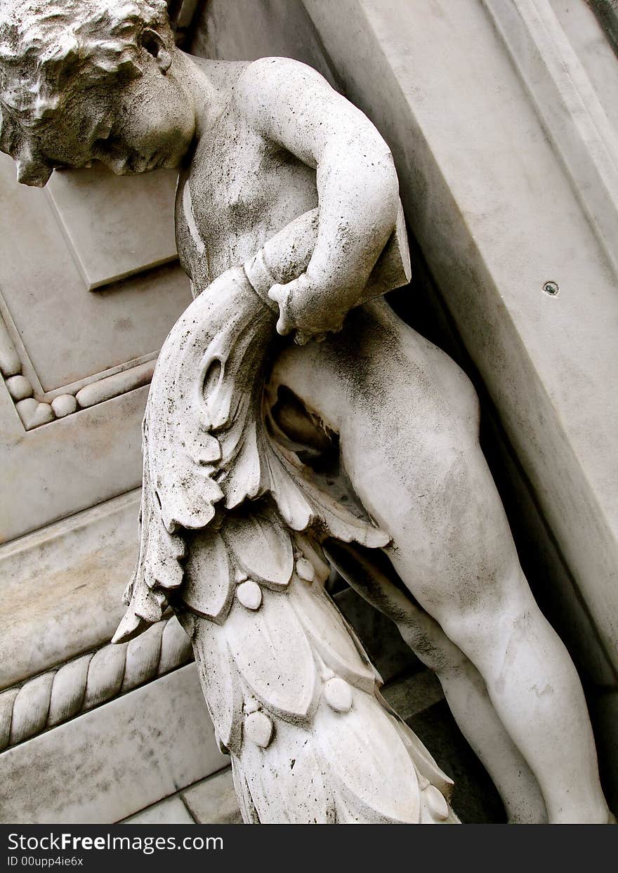 Detail of Recoleta Cemetery, Buenos Aires, Argentina.
The image shows a statue of a child. Detail of Recoleta Cemetery, Buenos Aires, Argentina.
The image shows a statue of a child.