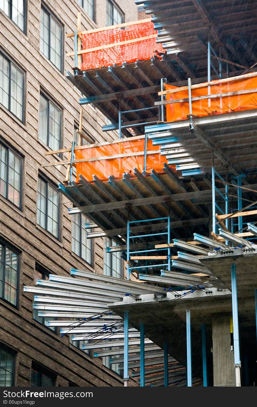 Interesting architectural construction scene on a rainy day. Interesting architectural construction scene on a rainy day