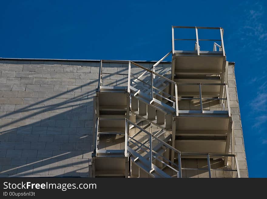 Architecture series: white building with safety stairs