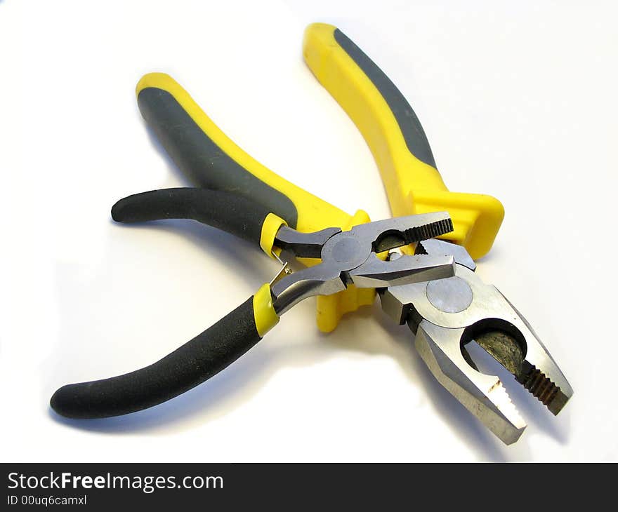 The Big And Small Flat-nose Pliers On A White Back