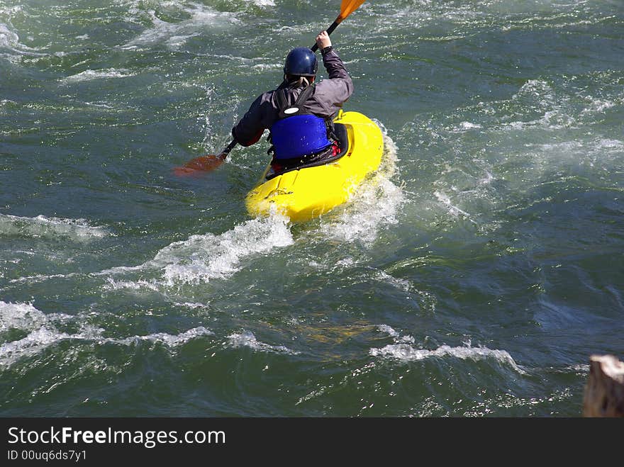 Yellow Kayak On The River