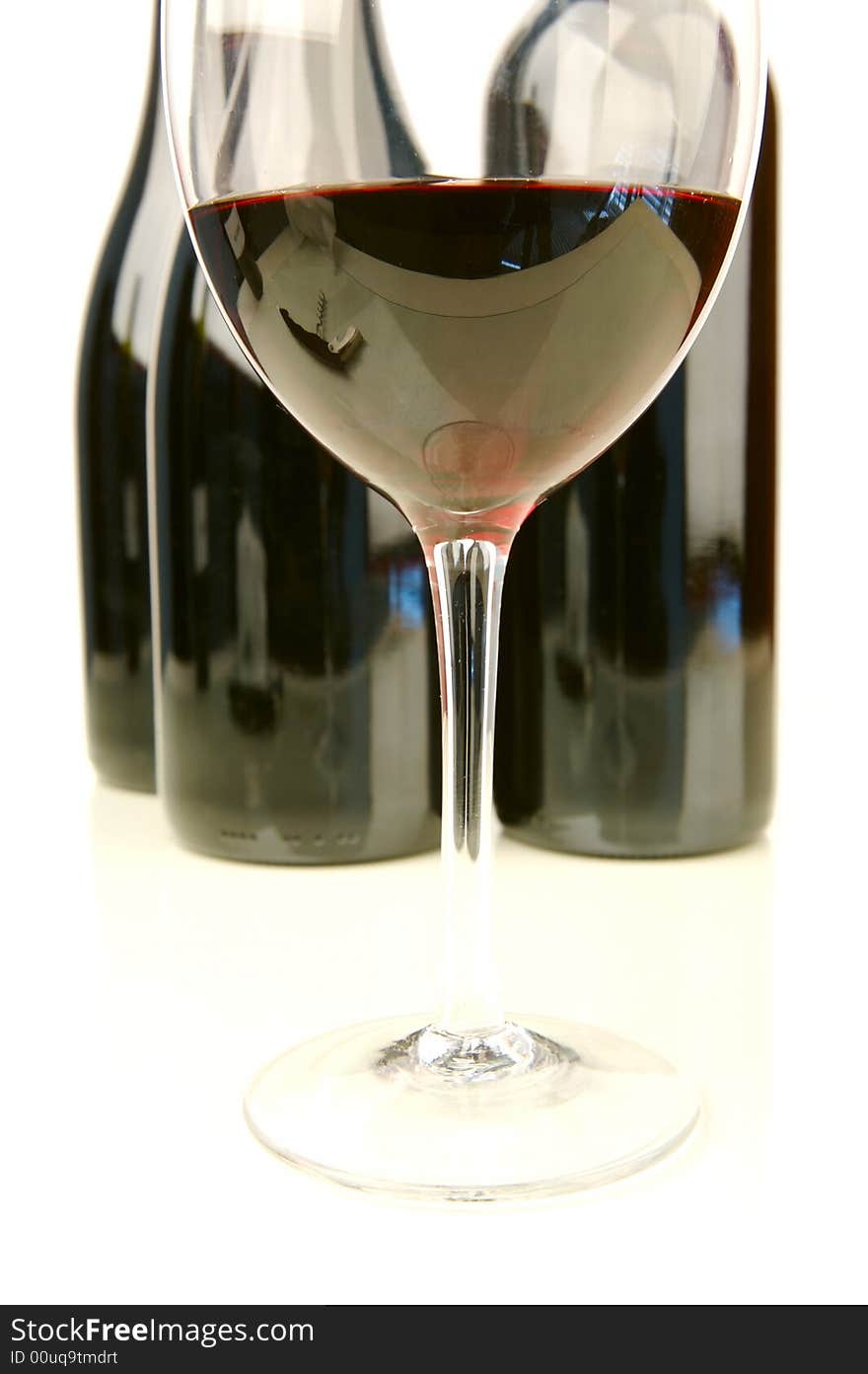 Red and white wine isolated against a white background. Red and white wine isolated against a white background