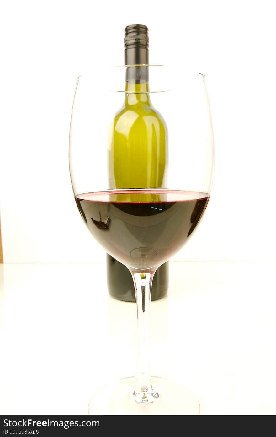 Red and white wine isolated against a white background. Red and white wine isolated against a white background