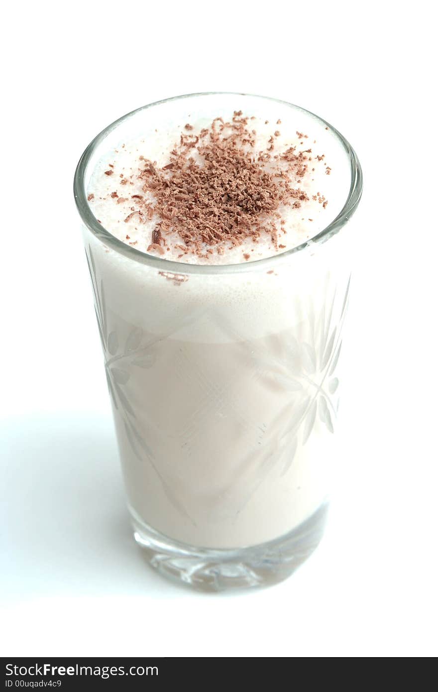 Glass with dairy chocolate drink on a white backgr