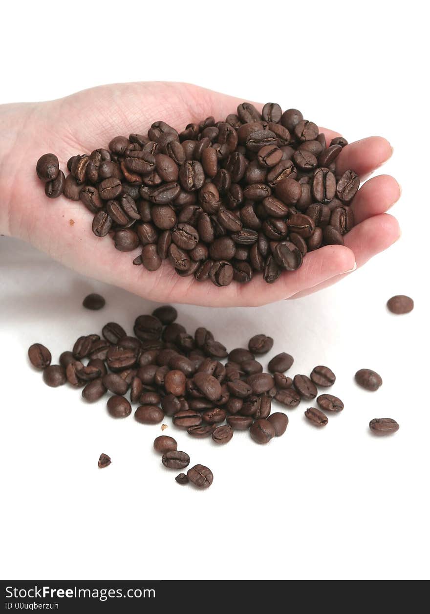 It is a lot of grains of coffee lay in hands