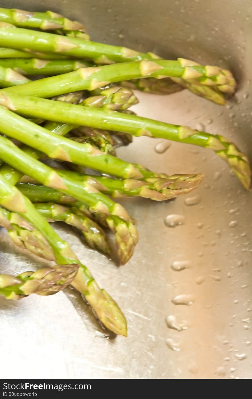 Washing asparagus shot with a macro lens getting ready for a healthy dinner. Washing asparagus shot with a macro lens getting ready for a healthy dinner