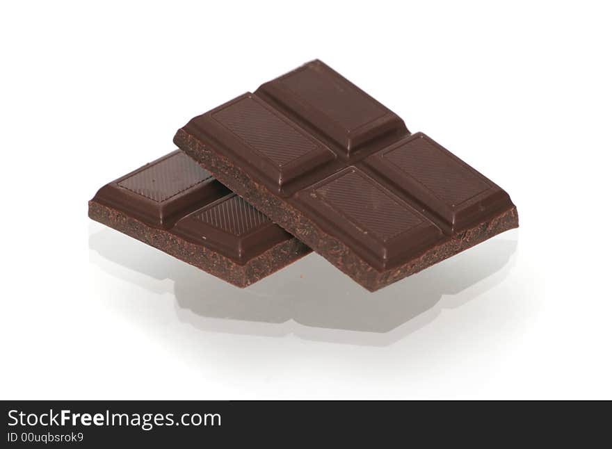 Two segments of chocolate on a white background