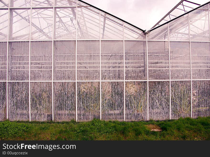 A greenhouse with chalk at the windows