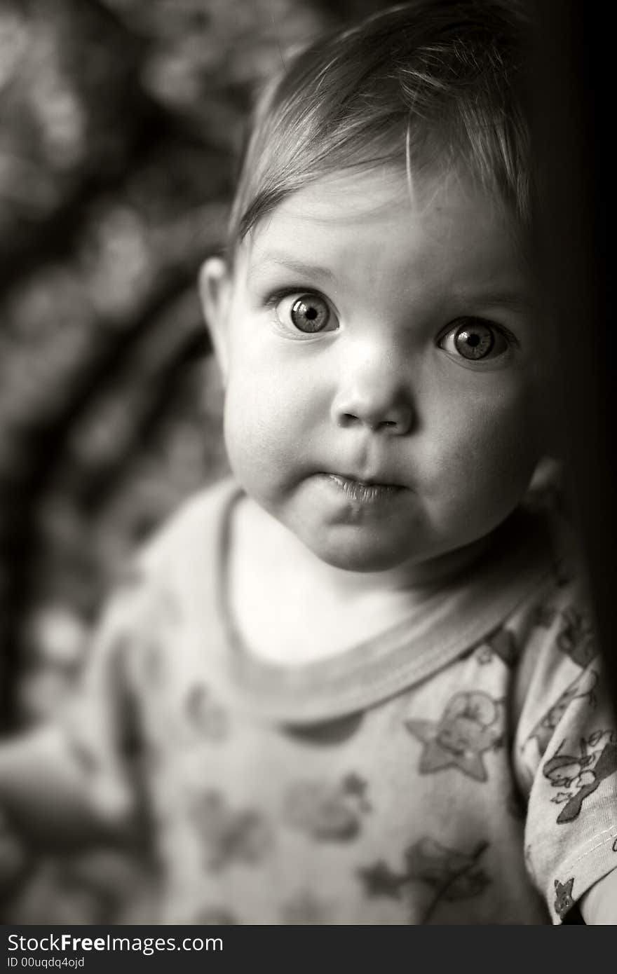 An black-and-white image of a child. An black-and-white image of a child