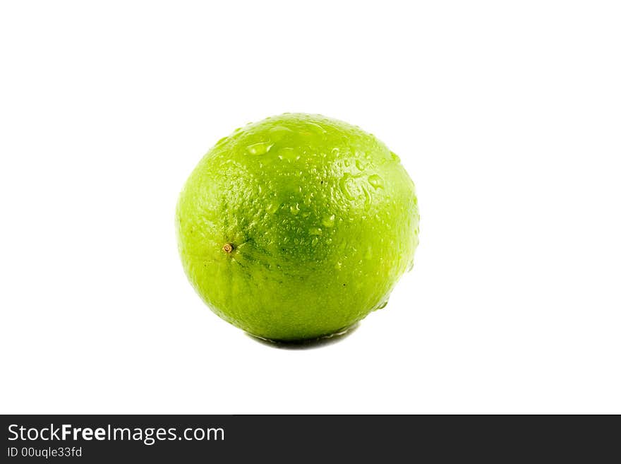 A Lime fruit with water drops isolated on white background