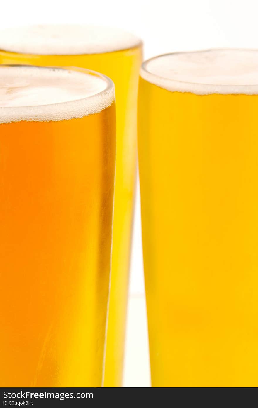 Ice cold beers isolated against a white background