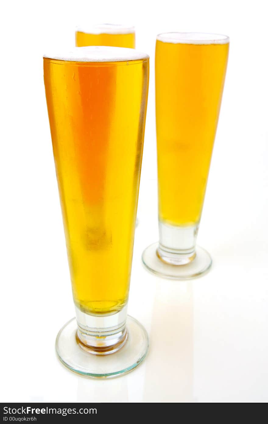 Ice cold beers isolated against a white background