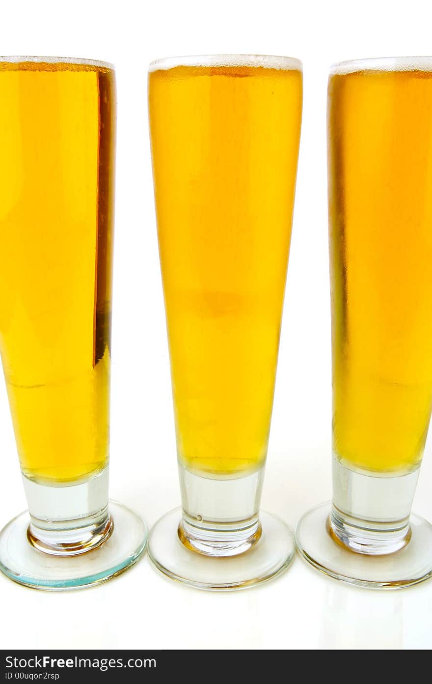 Ice cold beers isolated against a white background