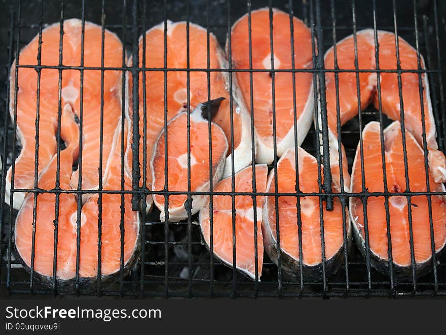 Close-up of grilled salmon pieces (background)