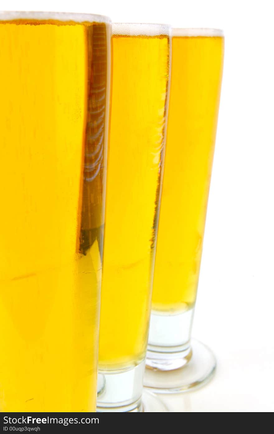 Ice cold beers isolated against a white background