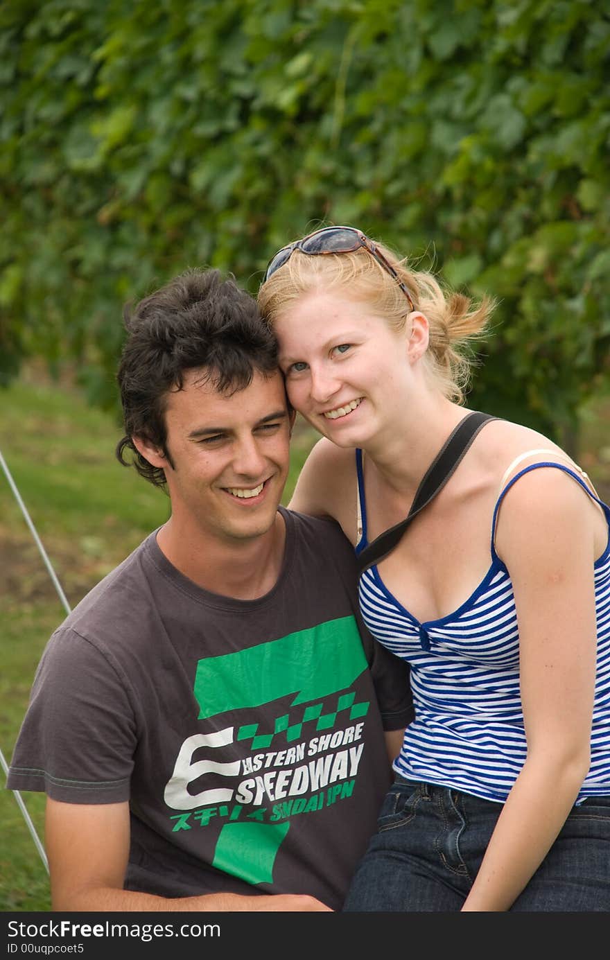 Smiling young couple at vineyard. Smiling young couple at vineyard