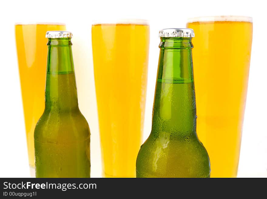 Ice cold beers isolated against a white background