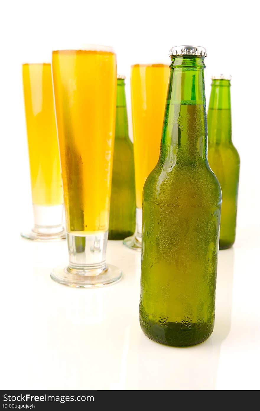 Ice cold beers isolated against a white background