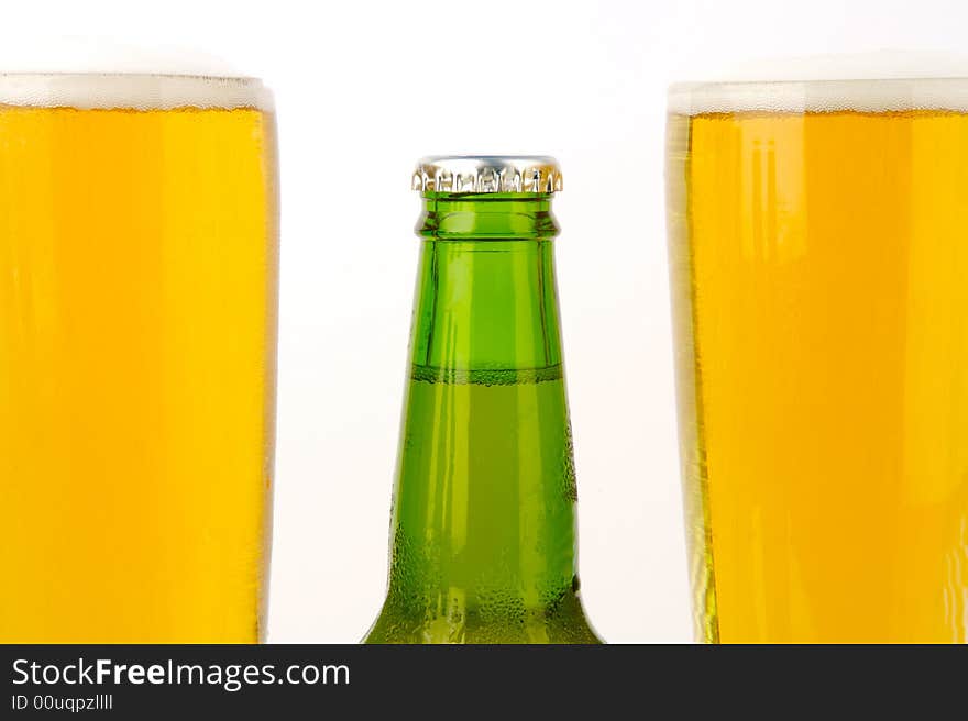 Ice cold beers isolated against a white background