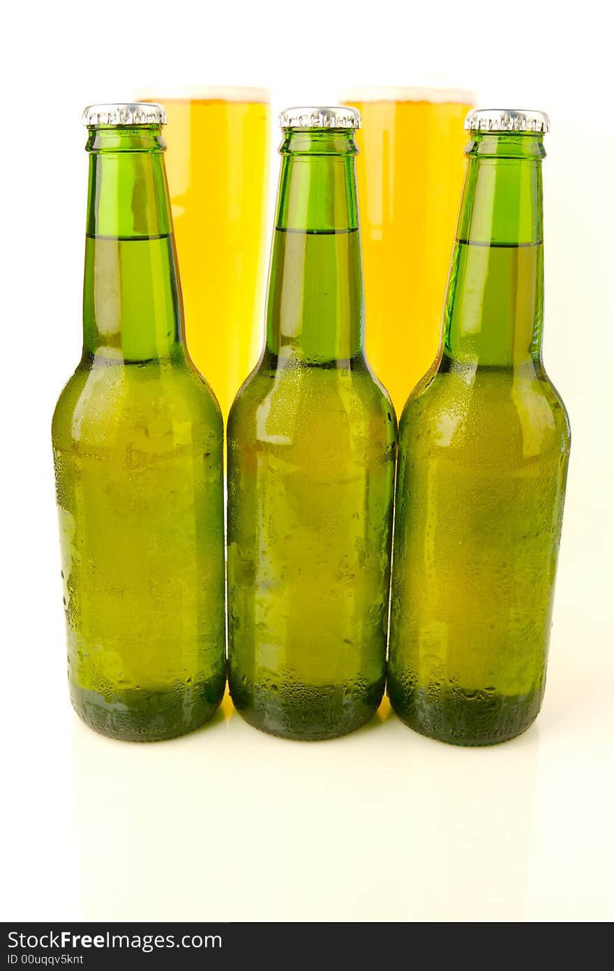 Ice cold beers isolated against a white background