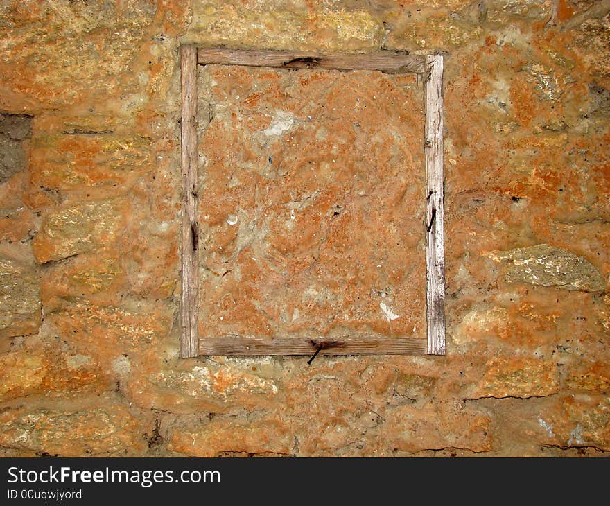 A Wooden Window Is In A Wall.