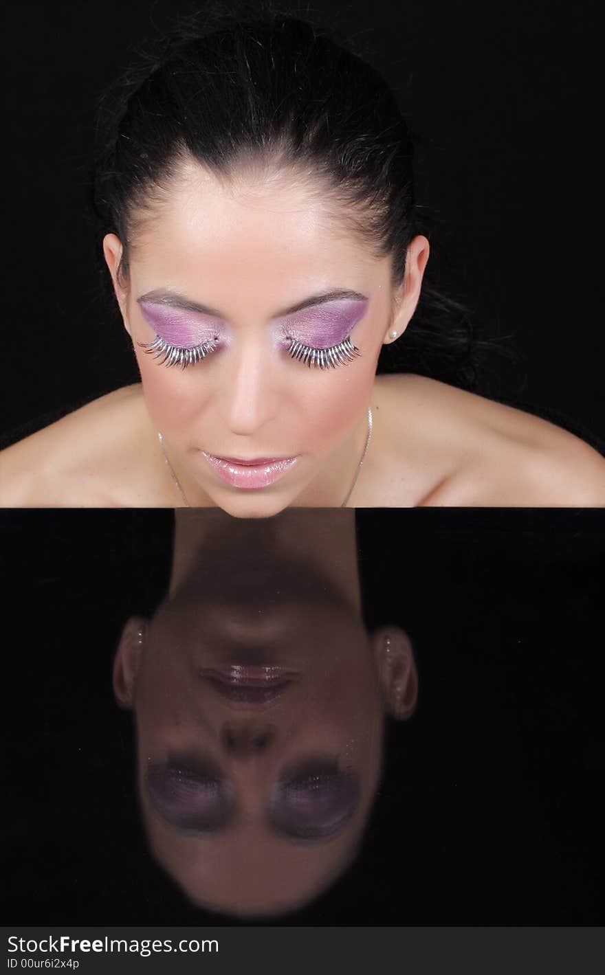 Close-up of a women wearing sohisticated make-up. Close-up of a women wearing sohisticated make-up