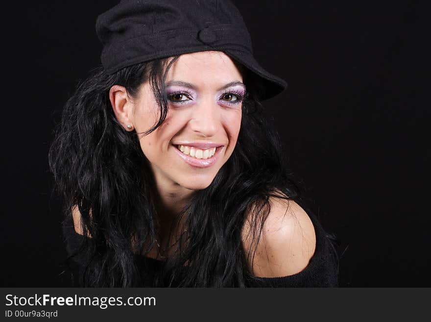 Close-up of a happy women weraring a cap and smiling. Close-up of a happy women weraring a cap and smiling