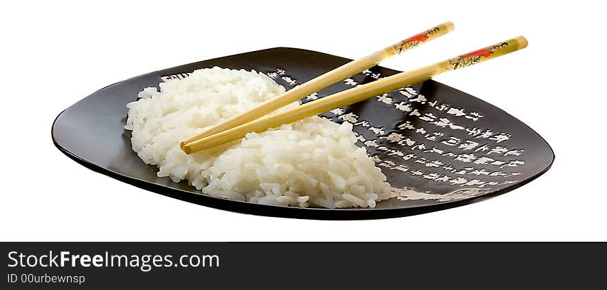 Isolated rice on the plate with hieroglyphes. Isolated rice on the plate with hieroglyphes