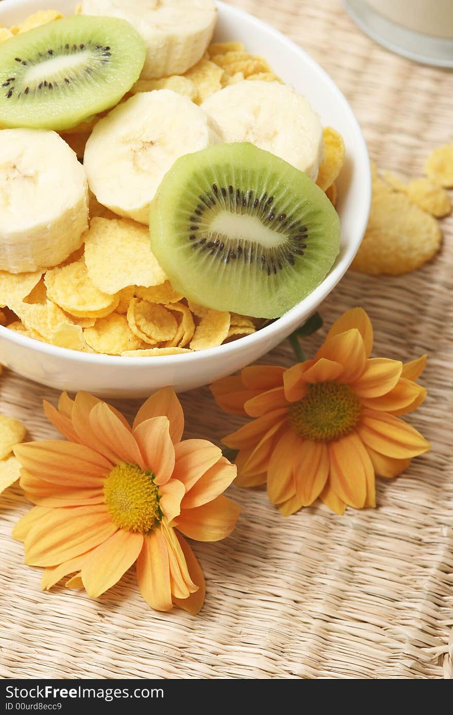 Healthy breakfast.Cornflakes and fruits with flowers. Healthy breakfast.Cornflakes and fruits with flowers.