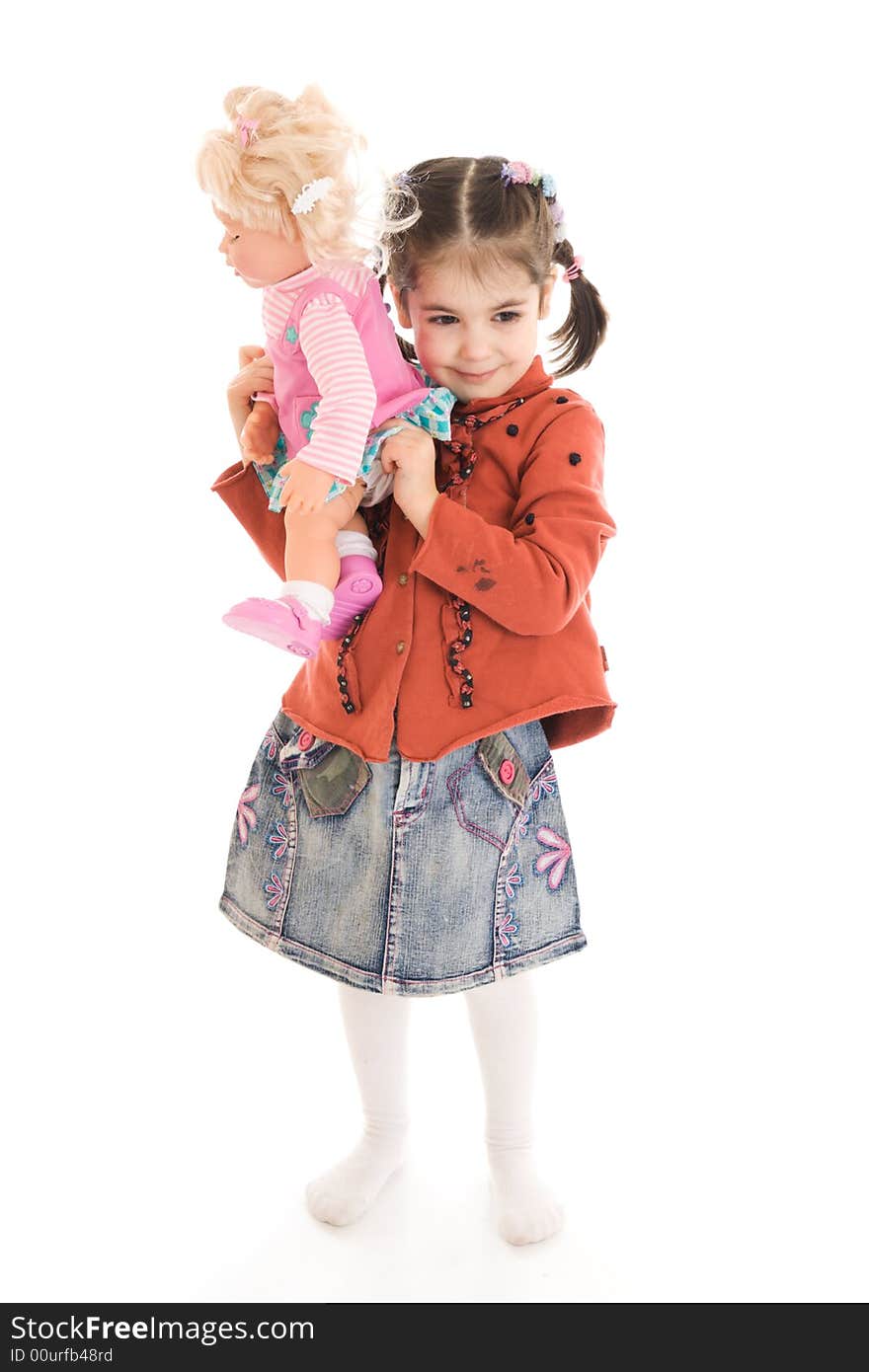 The little girl with a doll isolated on a white background