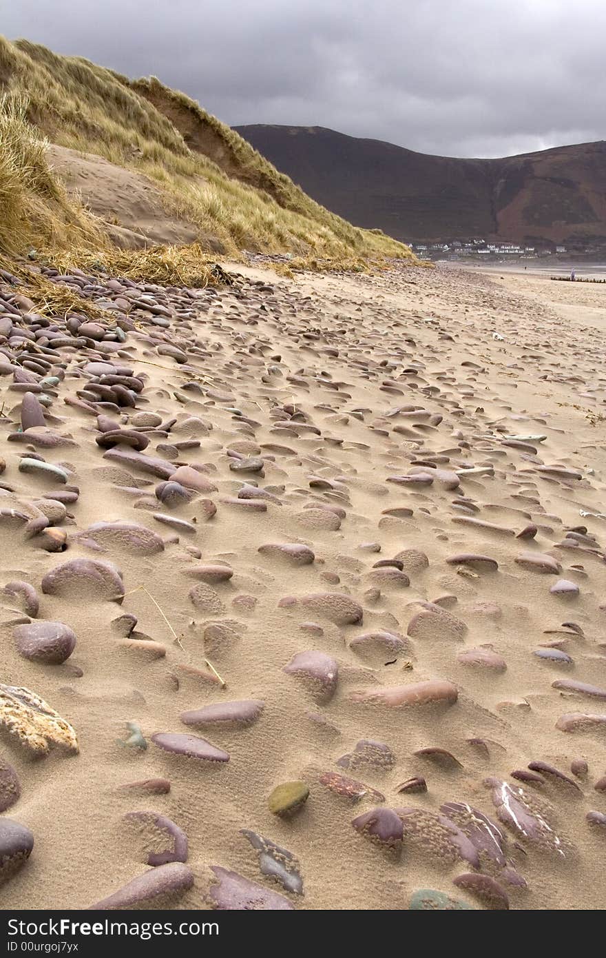 Pebbles on a sandy beach