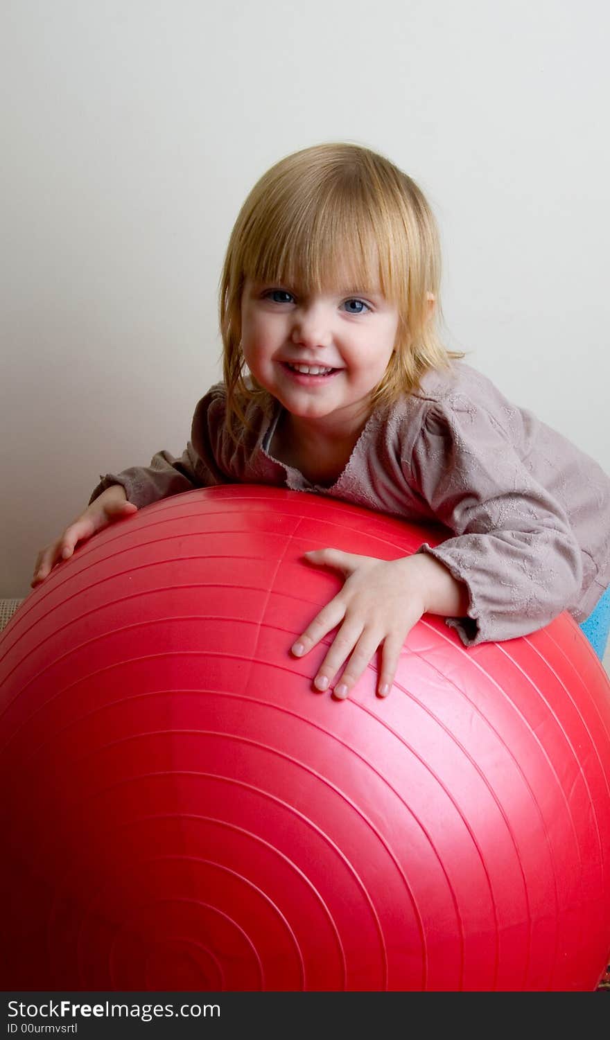 The little girl with a greater red ball. The little girl with a greater red ball