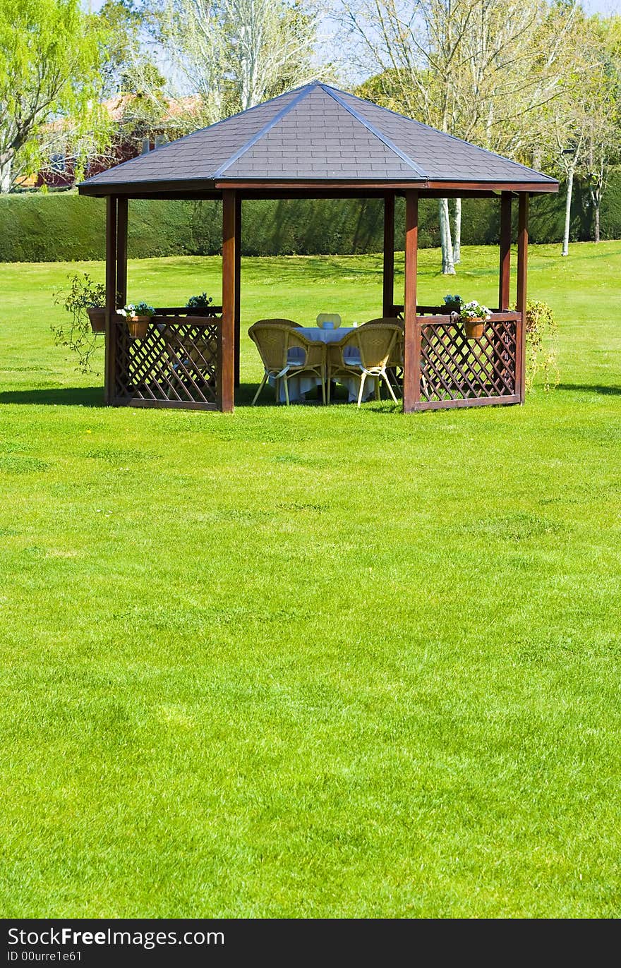 Garden with chairs for a coffe or tea break. Garden with chairs for a coffe or tea break