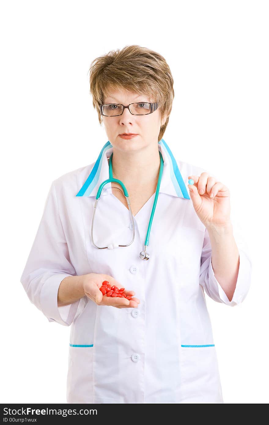 Woman doctor with pills in hands. Woman doctor with pills in hands